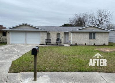 Curbside view of renovated property, titled "After"