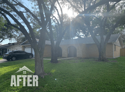 Curbside view of renovated property, titled "After"