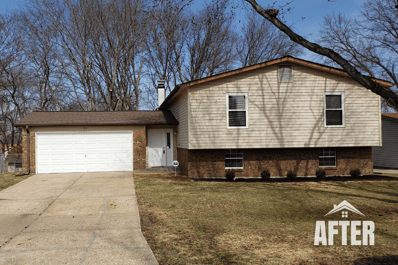 Curbside view of renovated property, titled "After"