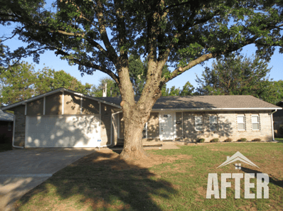 Curbside picture of a renovated house, titled "After"