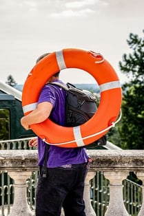 Guy Holding Emergency Raft