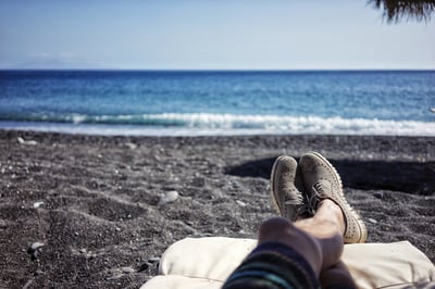 Feet propped up on the beach