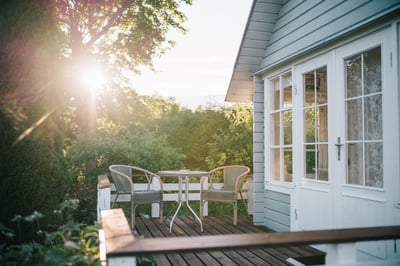 Sunny view of a home's side porch