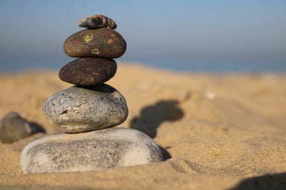 Rocks balanced on the sand