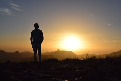 Man looking at sunrise