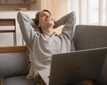 Man sitting back contentedly on couch